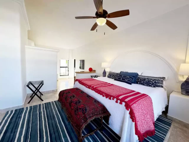 casita-2-king-bedroom-lejos-de-todo King bedroom with ceiling fan and decorative furnishings in Casita 2 at Lejos de Todo