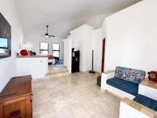 casita-2-living-area-lejos-de-todo Casita 2 living area with colorful seating and wooden furnishings at Lejos de Todo