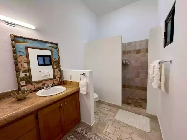 casita-4-bathroom-with-walk-in-shower-and-granite-vanity-at-lejos-de-todo Casita 4 bathroom with walk-in shower and granite vanity at Lejos de Todo