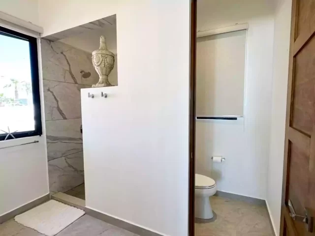 Casita 6 bathroom with walk-in shower and separate toilet area
