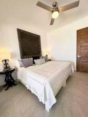 Casita 6 bedroom with king bed, bedside tables and decorative wall art