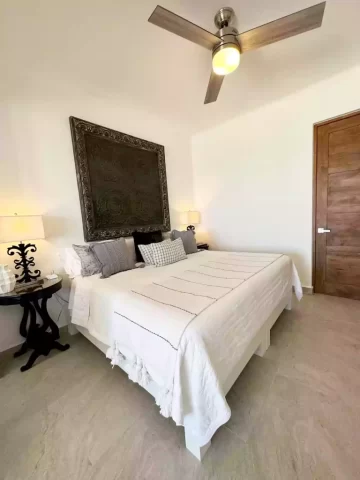 Casita 6 bedroom with king bed, bedside tables and decorative wall art