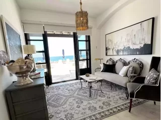 Casita 6 living area with seating, artwork and ocean view