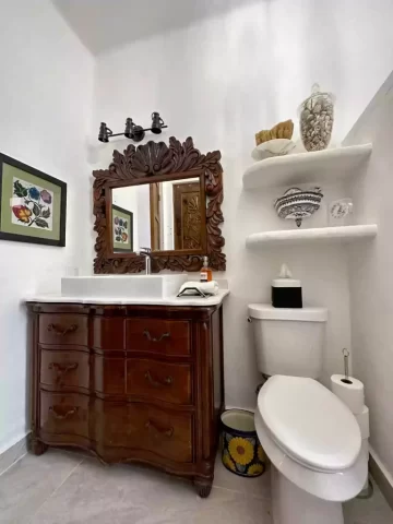 casita-7-bathroom-vanity Casita 7 bathroom vanity with carved wood cabinet, decorative mirror, and ceramic basin