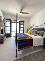 Casita 7 bedroom with colorful woven blanket and ocean view near Todos Santos